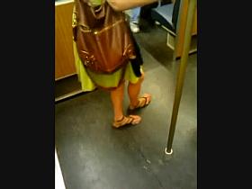 Feet in a metro train III
