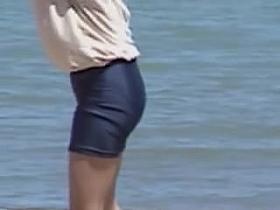 Short tight shorts on the amateur doll on the beach 01zq