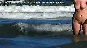 Hot body of an older woman in the water