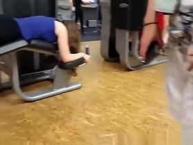 Chick in black sports pants exercising