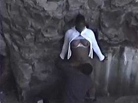 Guy fucks a black girl near rocks