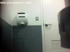 Sexy student girl spied while tinkling