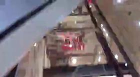 Cool chick in a blue dress at the mall.