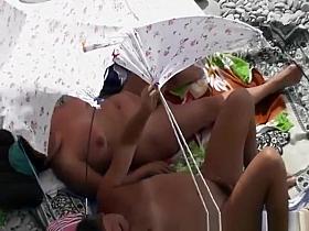 Mature woman fucked in the beach