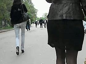 A hottie in black dominates this street upskirt video