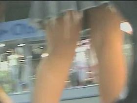 Upskirt voyeur gets into hot brunette's panties