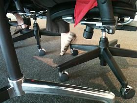 Shoe teasing below the desks...