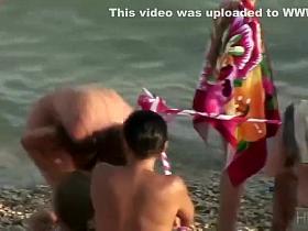 Sexy nudist girl spied in a bigger group