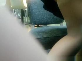 Exhibitionist woman in short black skirt spreads her legs