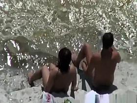 Chubby nudist woman sunbathing and swimming