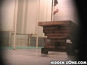 Babe taking shower seems to be hiding from spy cam