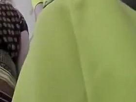 Slipping the camera right beneath her skirt