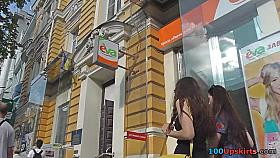 Upskirt voyeur filmed under slut's mini skirt