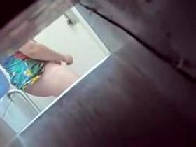 Horny hidden cam masturbation of female with lifted up dress