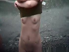 Group of nudist women in the beach