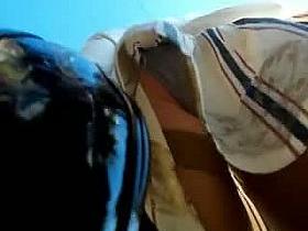 Candid street upskirt with cute blonde in black and white skirt