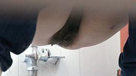 Bathroom spy cam video of Asian girl reading while pissing