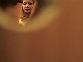 Girl spied through key hole baring tits off the bra