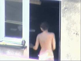 Nude titted minx caught on voyeur cam on the balcony