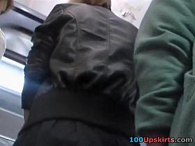 Blonde playgirl in grey mini