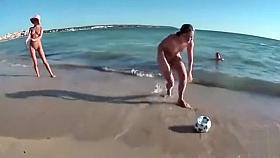 Four playful chicks and one ball