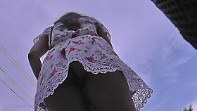 G-string upskirt footage of a hot auburn haired gal