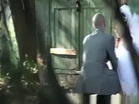 Bride caught with man peeing outdoors
