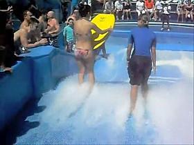 Cute flowrider got her bikini downblouse voyeured