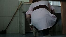 Pissing girl shot with a voyeur cam from under and above