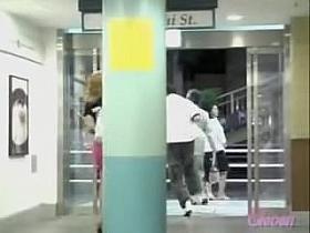 Hot babe in the pink skirt sharked inside the shopping mall