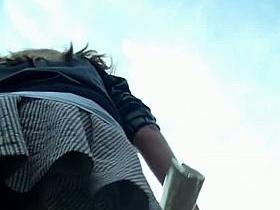 Up skirt video of a cute redhead in pantyhose