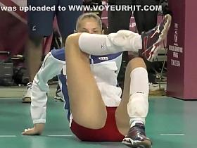 Pro sport babe stretches on the floor