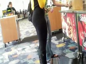 Black thong visible underneath pants