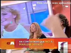 Italian diva in a short yellow dress shows off her long legs