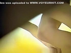 Girl in glasses caught by spy camera dressing