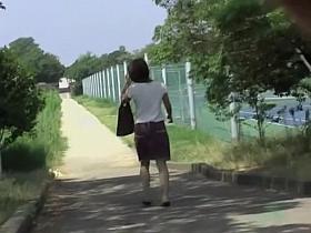 Hot Asian milf gets a nasty skirt sharking on a sunny day.