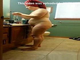 Mature woman with towel in head