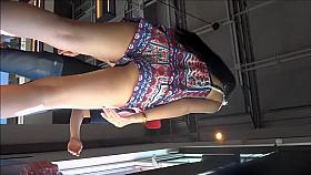 Long-legged brunette in tiny shorts gives a voyeur an eyefu