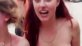 Nudists at the music festival pose for a group picture