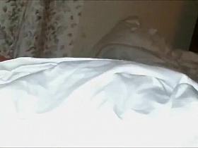 Showing off a tattoo over her hairy pussy