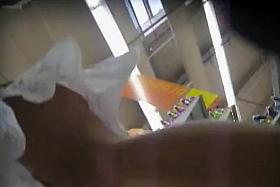 Sexy tanned ass under a skirt