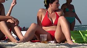 Brunette with nice big boobs on the beach