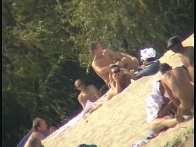 Busty nudist beach MILF caught on a hidden cam