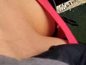 Sexy babe in red dress downblouse view