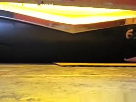 Woman undressing in tanning room