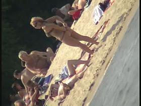 Naked tourists caught on beach spy cam relaxing and enjoying nudity