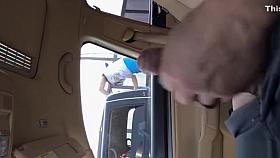 Guy strokes dick in car