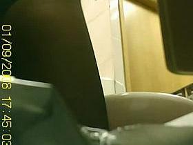 Pissing voyeur brunette milf in a public toilet