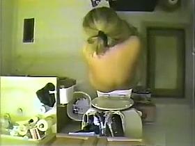 Naked blonde pees but does not flush it down