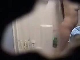 Spy shower cam gets mature babe showering